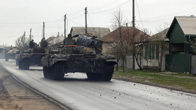 Tanks of Ukrainian Armed Forces ride along a street in a village, as Russia's attack on Ukraine continues, in Donetsk Region