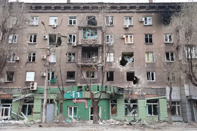 A view of damaged buildings in the Ukrainian city of Mariupol under the control of Russian military and pro-Russian separatists, 17 April 2022