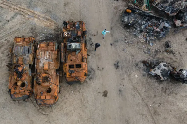 Burnt military APCs in a field where destroyed vehicles are being brought, on April 18, 2022 in Bucha, Ukraine.