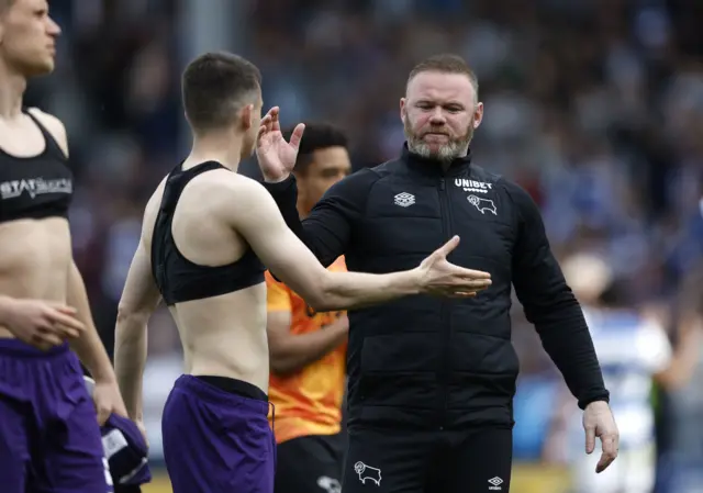 Wayne Rooney consoles his players after Derby's relegation to League One