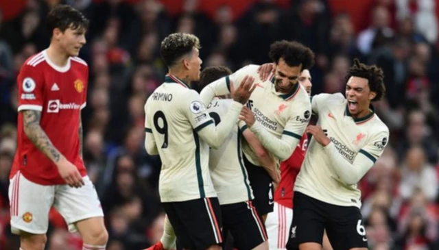 Liverpool celebrate scoring at Old Trafford