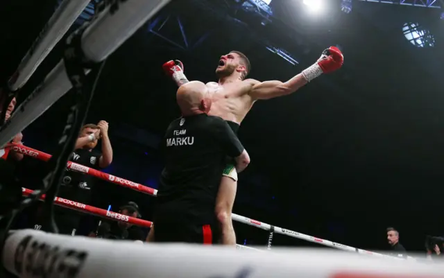 Florian Marku celebrates