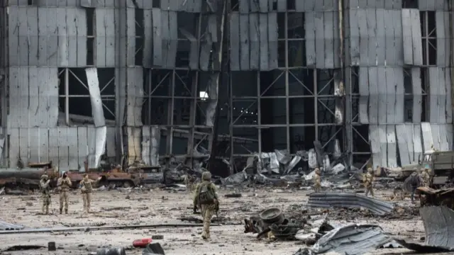 Ukrainian service members inspect a compound of the Antonov airfield, as Russia"s attack on Ukraine continues