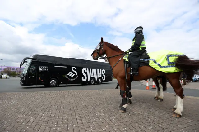 Swans coach and police on horse