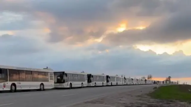 Row of buses ready to evacuate civilians from Mariupol