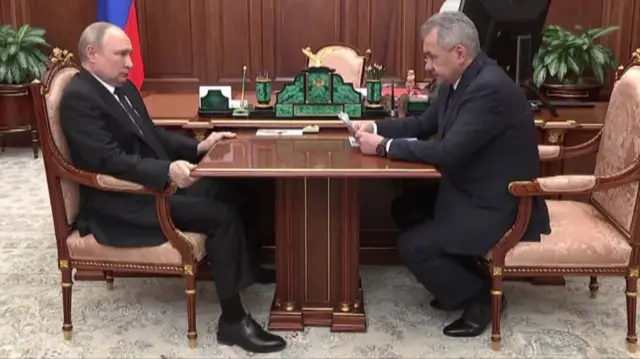 Vladimir Putin and Defence Minister Sergei Shoigu