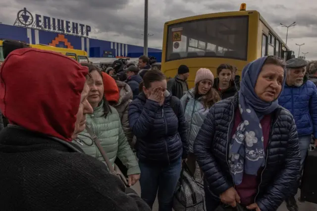 People from Mariupol gather after arriving on an evacuation bus to the evacuation point in Zaporizhzhia, Ukraine, on 21 April 2022