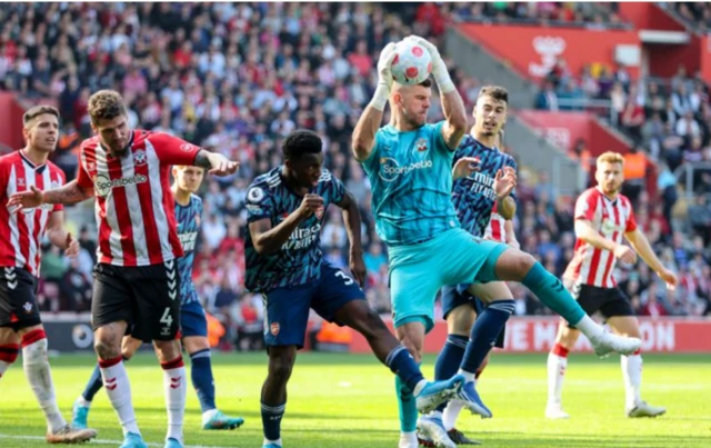 Fraser Forster catches the ball