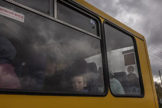 People from Mariupol arrive on an evacuation bus in Zaporizhzhia on 21 April 2022