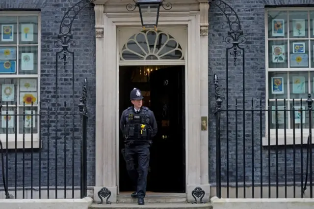 A police officer stands outside 10 Downing Street