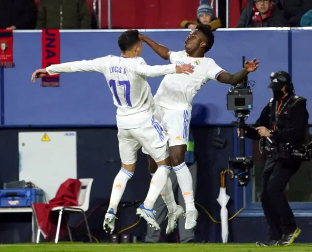 Lucas Vazquez and Vinicius Junior celebrate after Real Madrid's third goal against Osasuna