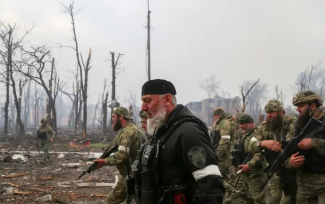 Russia's State Duma member Adam Delimkhanov surveys Azovstal alongside Chechen troops