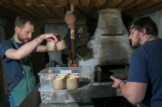 Volunteers prepare Easter cakes in an old bakery which survived during Russia"s invasion in the town of Bucha