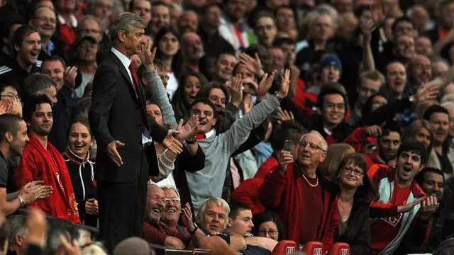 Arsene Wenger in Old Trafford stand after being sent off