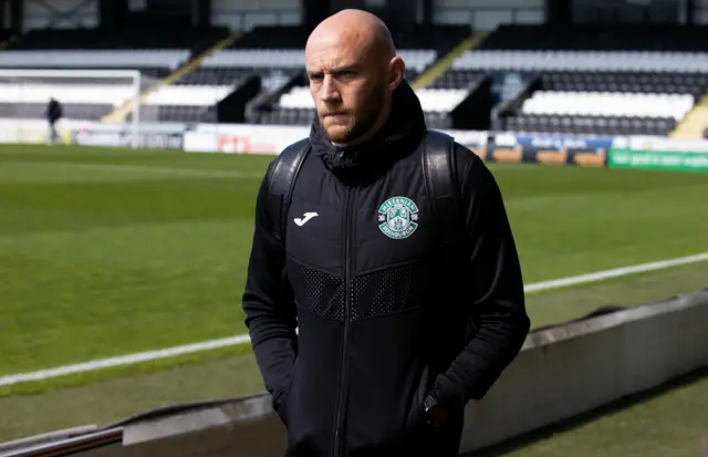 David Gray walks pitchside at St Mirren