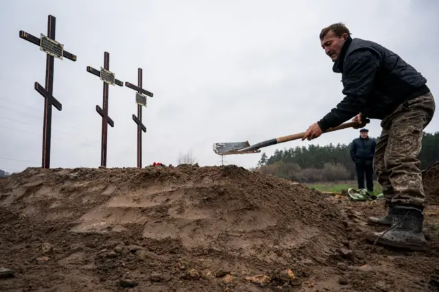 Cemetery workers in Kyiv dig graves for civilians killed in nearby Bucha