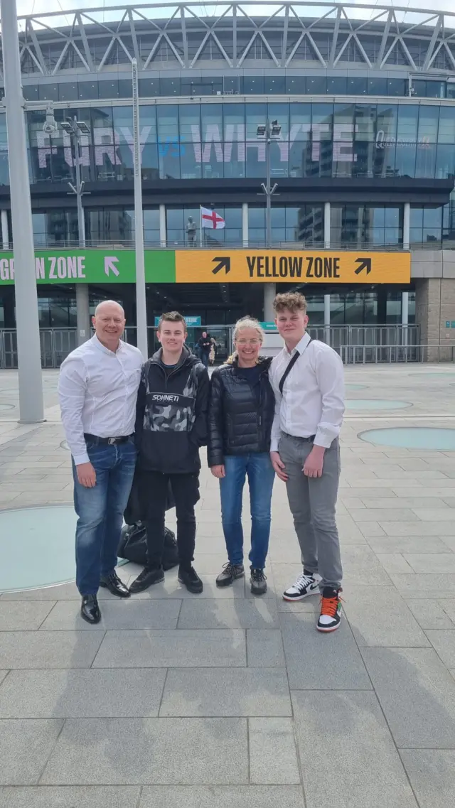 Family standing outside Wembley Stadium