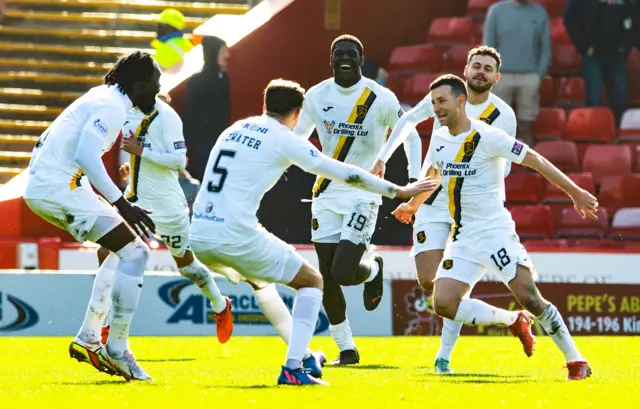 Livingston celebrate Jason Holt's penalty that made it 2-0