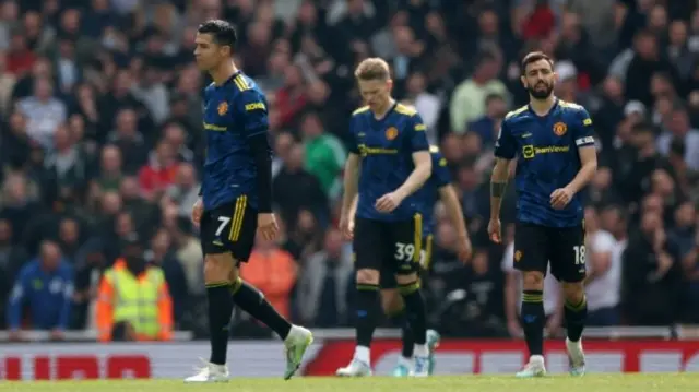 Manchester United players look dejected after Arsenal's first goal