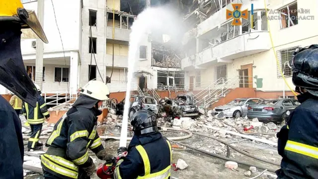 Image shows firefighters working to extinguish flames