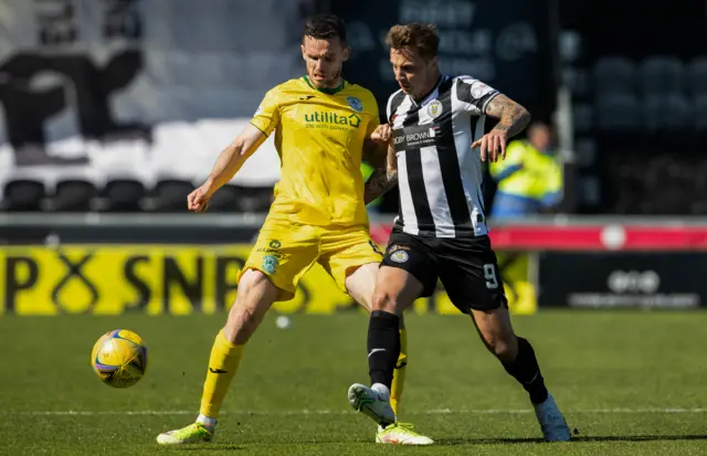 Paul McGinn and Eamonn Brophy battle for possession