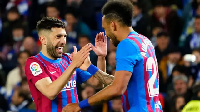 Barcelona players Jordi Alba and Pierre-Emerick Aubameyang celebrate scoring against Real Sociedad