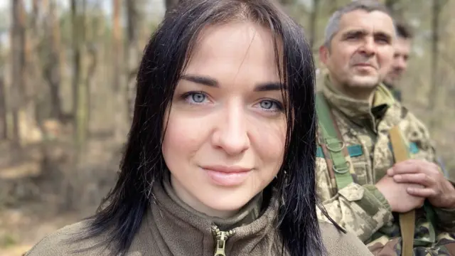 Yana, a fighter with Kyiv's Territorial Defence, has a message for her colleagues on the frontline: stay strong