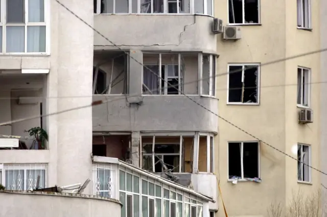 Exterior view of a damaged block of flats in Odesa