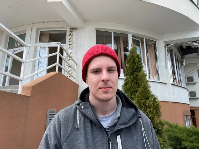 Portrait of Kiril in front of a residential building in Odesa