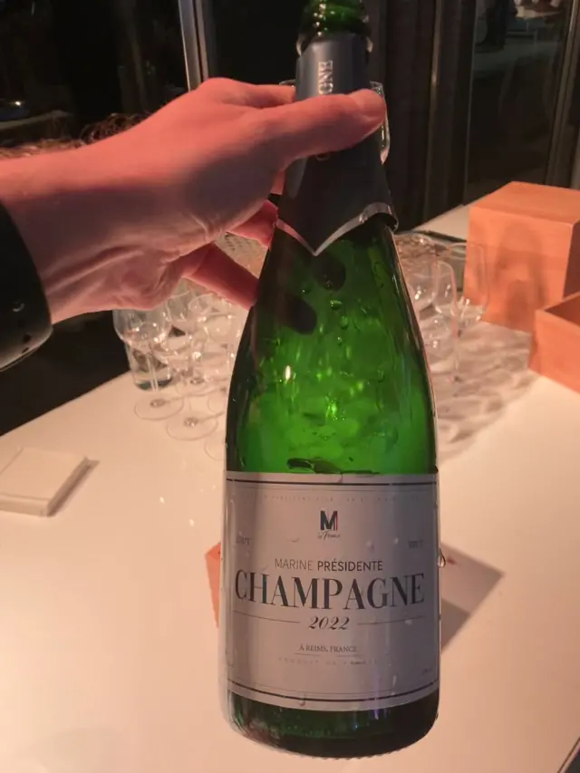 Marine Présidente bottle of champagne at Marine Le Pen's headquarters in Paris