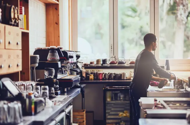 Stock image of a man working in a coffee shop