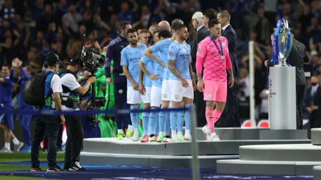 Man City players collect medals