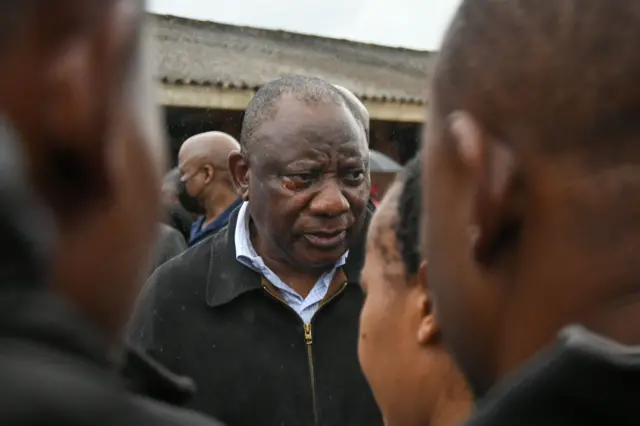 Cyril Ramaphosa visits residents in flood-hit Durban on 13 April.