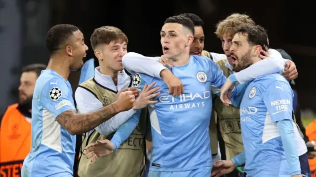 Phil Foden (centre) celebrates