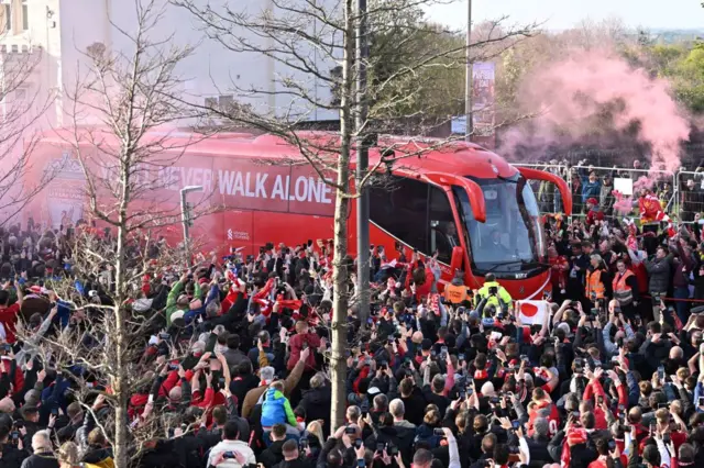 Liverpool fans welcome team bus