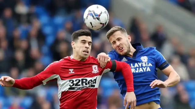 Martín Payero of Middlesbrough competes for a header with Will Vaulks