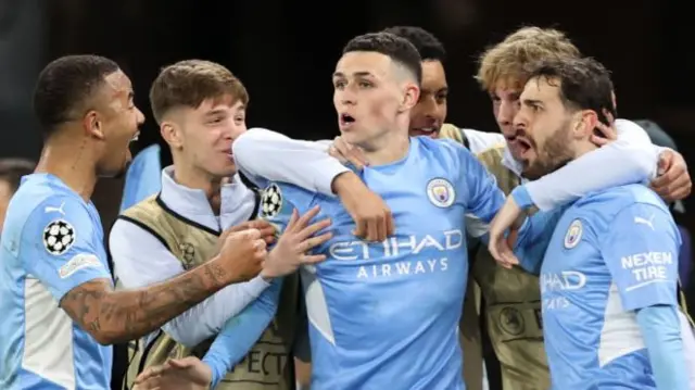 Phil Foden (centre) celebrates