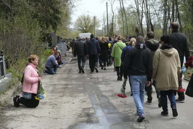 People paying their respects to a deceased soldier in Kyiv, Ukraine. 27 April 2022