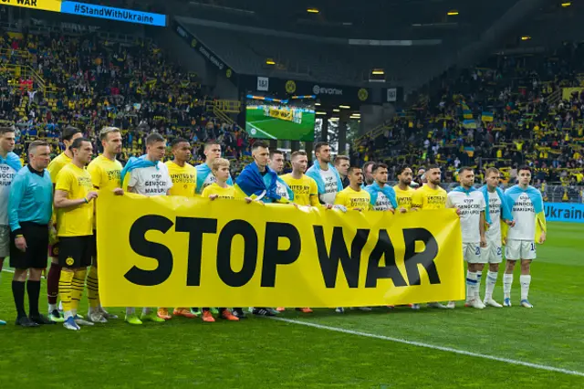 Players of Borussia Dortmund and Dynamo Kiew with a banner STOP WAR during a friendly match in Dortmund, Germany