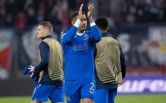 James Tavernier applauds the large travelling support in Germany