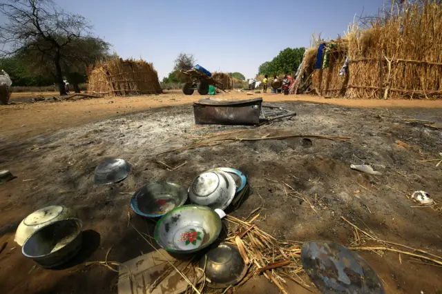 A picture shows burnt utensils in the village of al-Twail Saadoun, which was attacked during inter-ethnic violence, 85 kilometres south of Nyala town, the capital of South Darfur, on February 2, 2021.