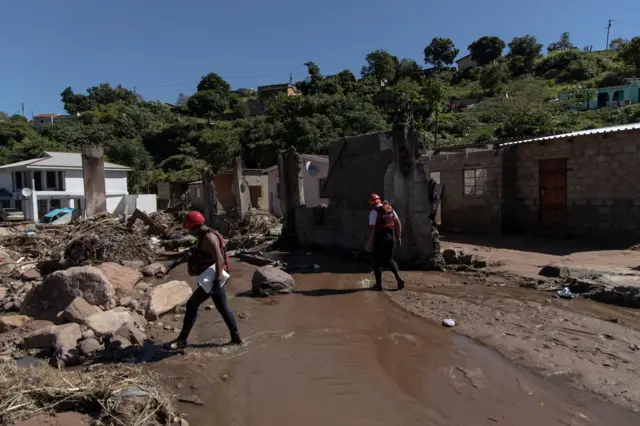 Members of a South African Police Service (SAPS) search and rescue unit searches for a missing 23 year old man in KwaNdengezi, west of Durban, on April 20, 2022