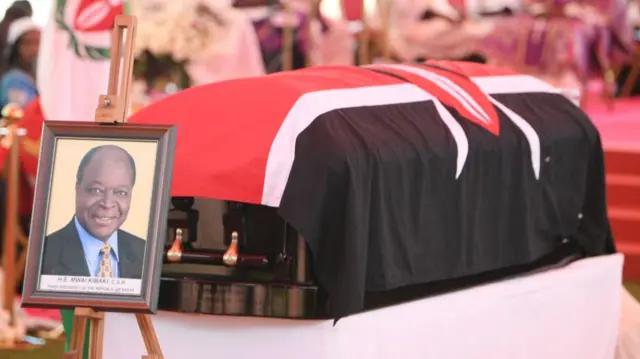 The flag-draped coffin of former Kenyan President Mwai Kibaki lies in state during the memorial service at the Nyayo National Stadium in Nairobi - 29 April 2022