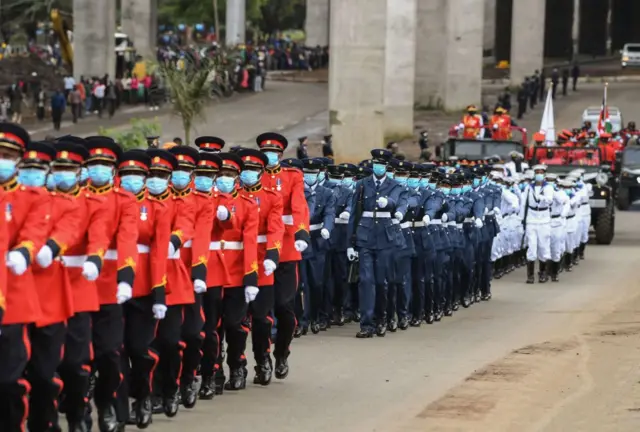 The casket carrying the remains of former Kenyan President Mwai Kibaki is escorted from the State House to his memorial service at the Nyayo National Stadium in Nairobi - 29 April 2022