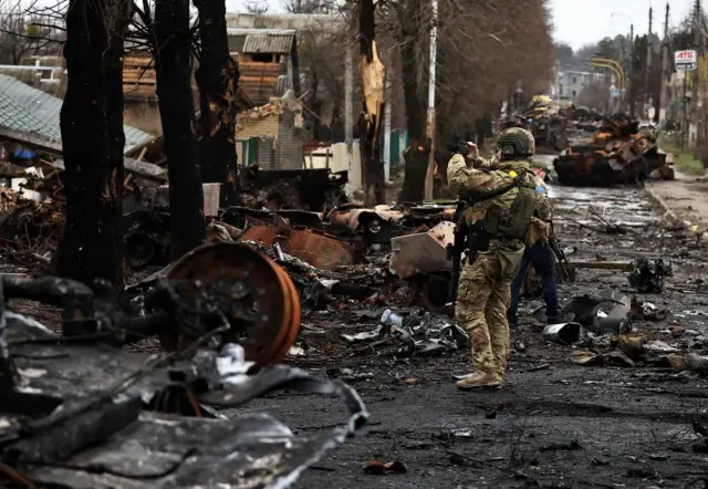 Ruined tanks in a street in Bucha