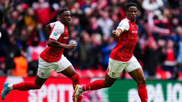 Rotherham players celebrate their third goal