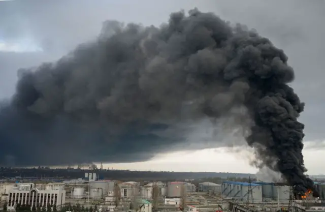 Image shows flames and smoke rising out of ground