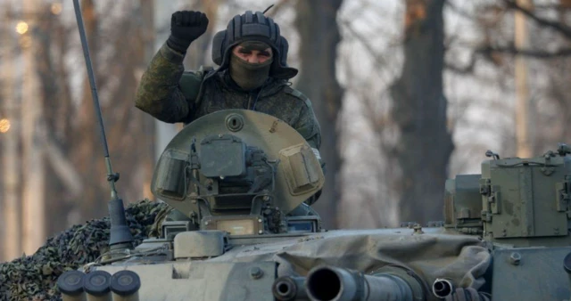 A Russian solider on a tank in the Donetsk region