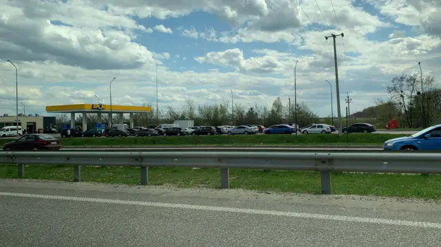 A queue of cars waiting for fuel outside a petrol station in Kyiv