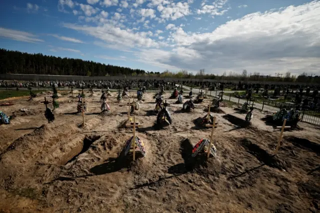 A view of new graves for people killed during Russia's invasion of Ukraine, at a cemetery in Bucha, near Kyiv, 28 April